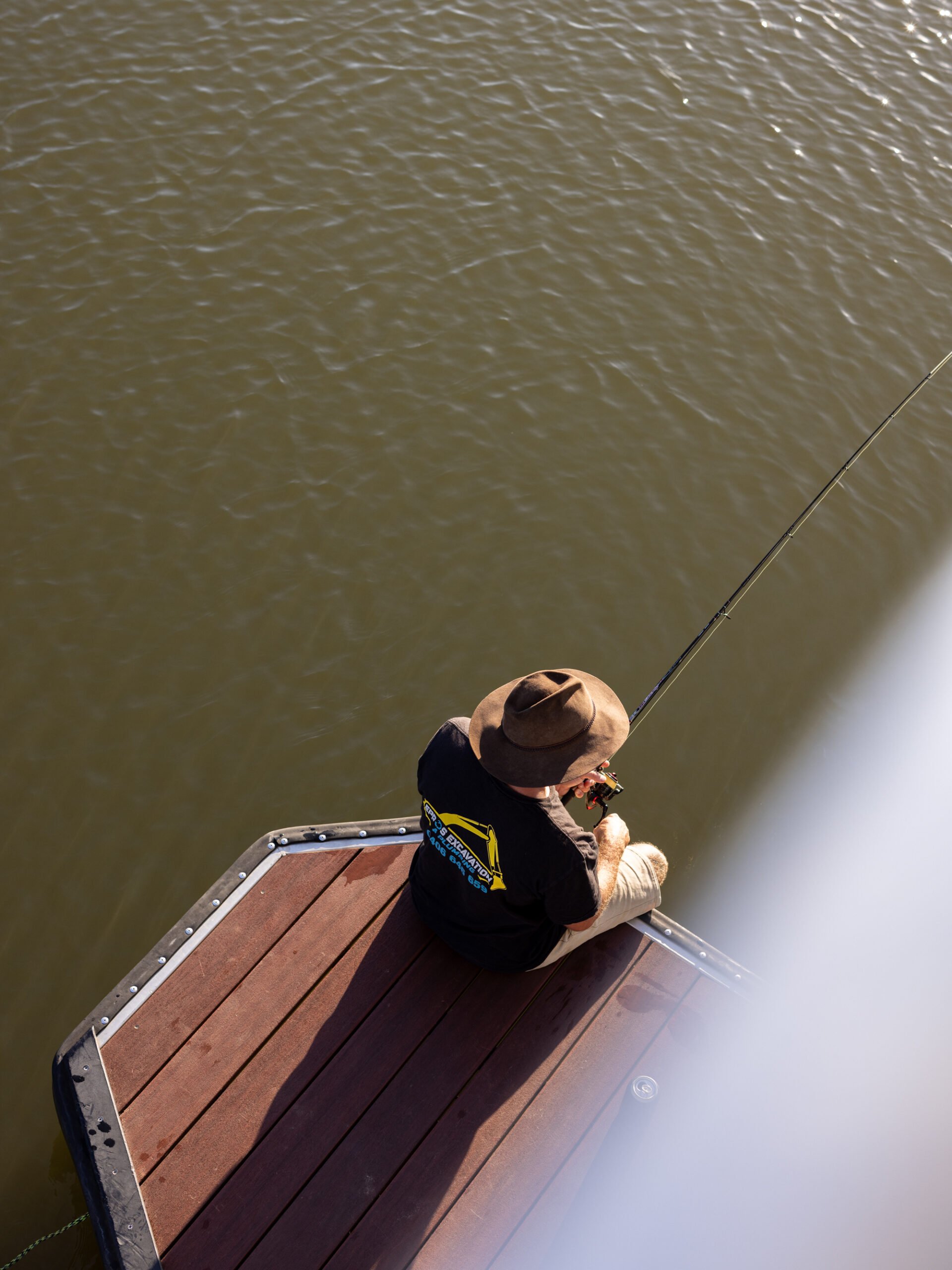 Fishing off the back deck of a house boat
