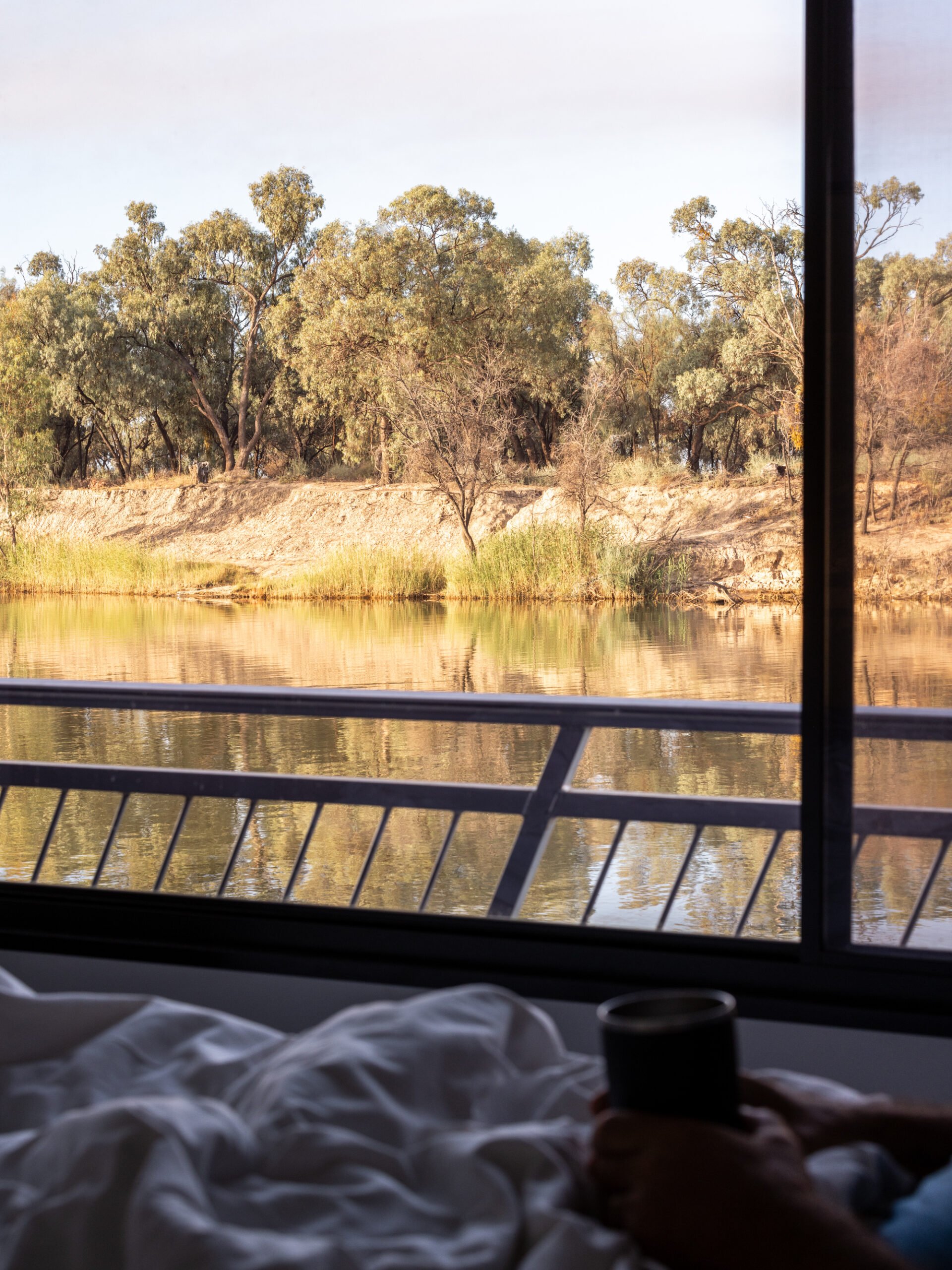 Coffee in bed in a house boat on the Murray River